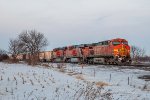 BNSF 5713 GE AC44CW and BNSF 5926 GE ES44AC and sister unit work a westbound empty hopper train